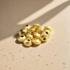 DIY handcrafted jewelry accessories with golden textured beads details Picture